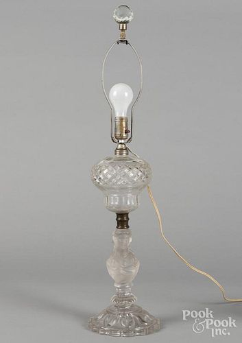 Colorless glass fluid lamp with a frosted bust of a woman, 31 1/2'' h.