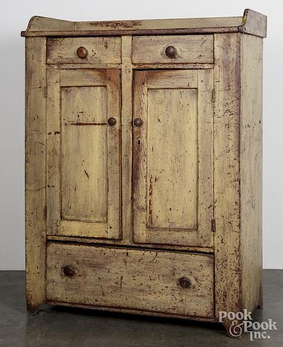 Painted pine jelly cupboard, 19th c., retaining a yellow surface, 58'' h., 43'' w.