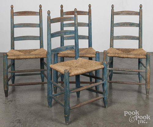 Set of four painted ladderback chairs, 19th c., with a rush seat, retaining a blue surface.