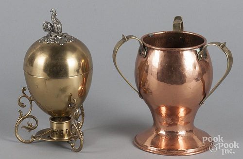 German brass egg poacher, 9 1/2'' h., together with a hand hammered copper and brass loving cup, 8'' h