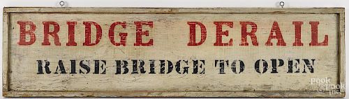 Painted pine trade sign, 20th c., inscribed Bridge Derail - Raise Bridge to Open