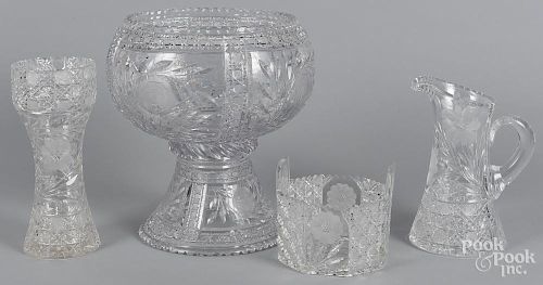 Cut glass, to include a punch bowl on a stand, 15'' dia., a water pitcher, a vase, and an ice bucket.
