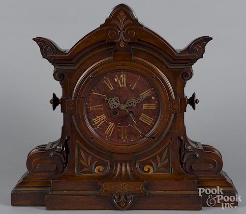 Massive carved walnut mantel clock with a marble face, late 19th c., 22 1/4'' h.