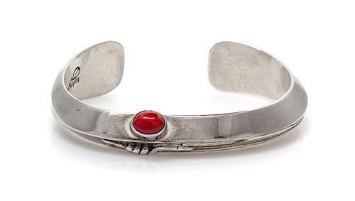 * A Sterling Silver and Coral Cuff Feather Motif Cuff Bracelet, Ben Begay, Navajo, 30.20 dwts.