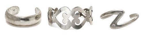 A Collection of Sterling Silver Cuff Bracelets, 148.30 dwts.