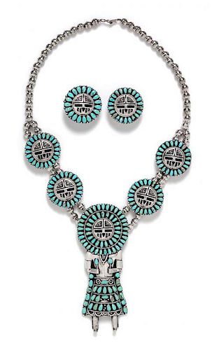 * A Sterling Silver and Turquoise Sunface Kachina Doll Motif Demi Parure, Larry Moses Begay, Navajo, 91.90 dwts.