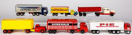 Six toy tractor trailers