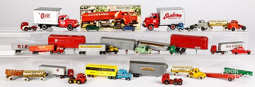 Group of small toy tractor trailers