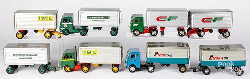 Four Japanese tin friction tandem tractor trailers