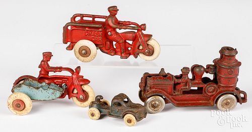 Four cast iron toys