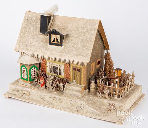 Large cardboard snow covered Christmas house