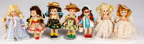 Seven hard plastic Ginny dolls