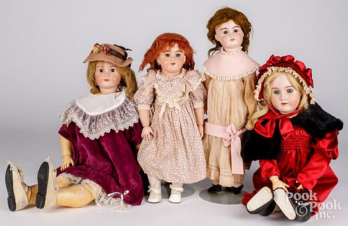 Four large bisque head dolls
