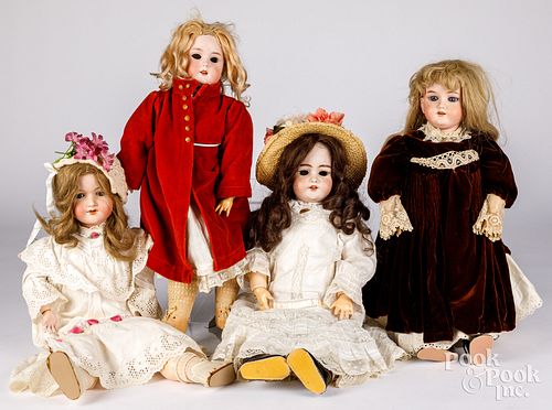 Four bisque head dolls