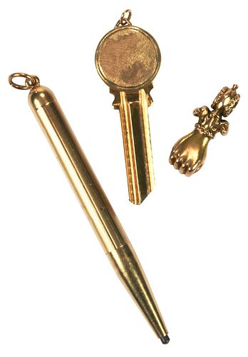 Three Gold Items: Pencil, Uncut Key, and Mano Figa Charm