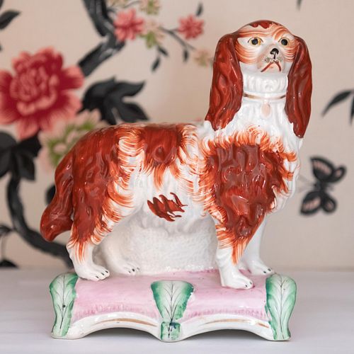 Pair of Staffordshire Dogs on Plinths and a Spaniel on a Pillow