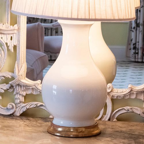 Pair of Cream Glazed Porcelain and Giltwood Lamps