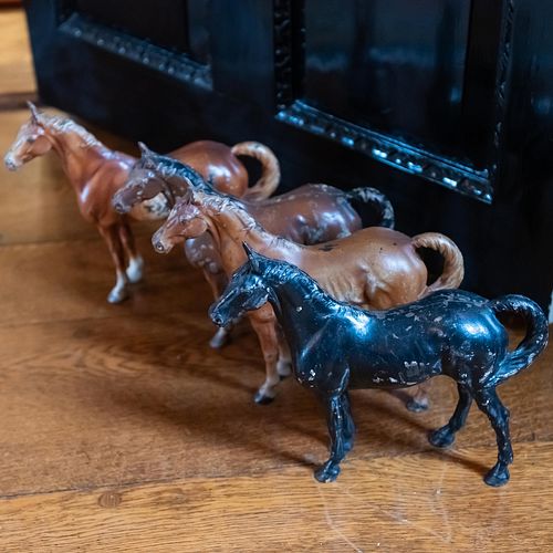 Group of Four Painted Iron Horse Form Door Stop