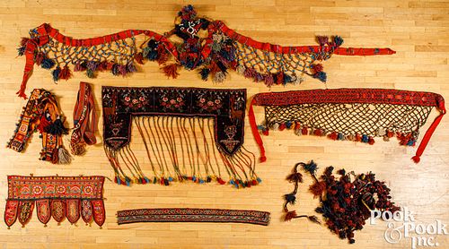 Oriental woven sashes and animal dressings