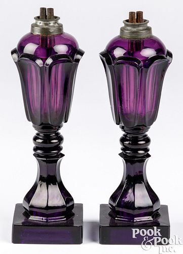 Pair of amethyst glass oil lamps, 19th c.