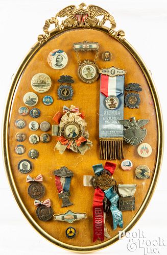 Three framed groups of political buttons