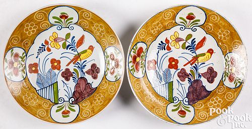 Pair of polychrome delftware chargers, 18th c.