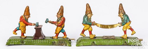 Two tin lithograph animated gnomes penny toys