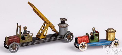 Two tin fire truck penny toys