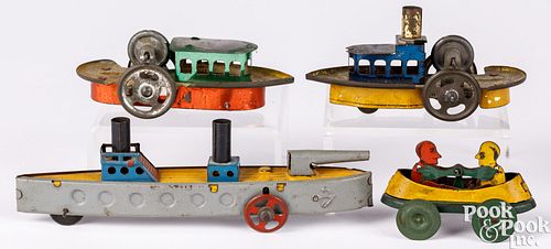 Four tin boat penny toys