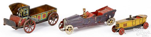 Three tin lithograph vehicle penny toys