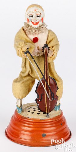 German painted tin and composition clockwork clown