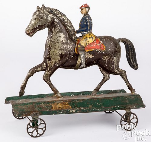 Large tin horse and rider pull toy