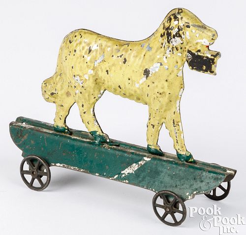 Painted early American tin dog pull toy