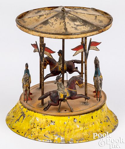 Painted tin wind-up plink plunk carousel