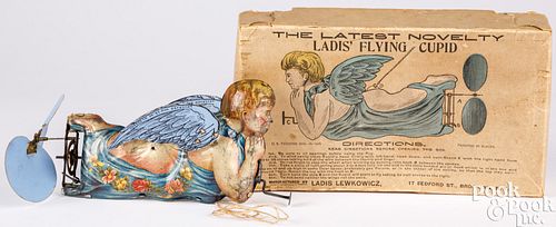 Tin lithograph windup Ladis Flying Cupid