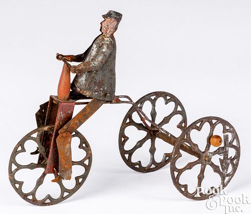 Unusual tin wind-up man on tricycle