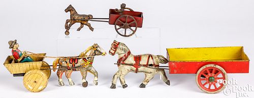 Four tin lithograph horse drawn carts