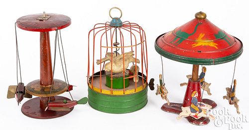 Tin and wood children on rabbits carousel toy