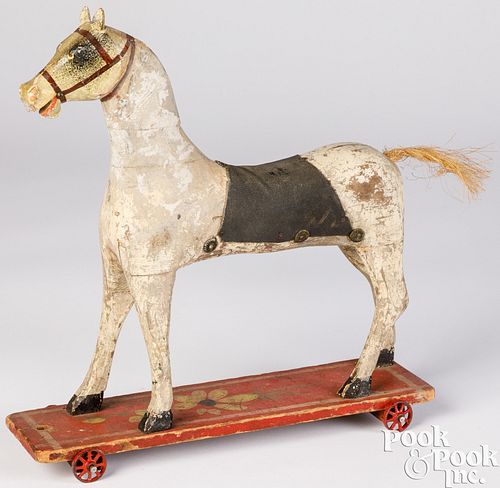 Carved and painted wood platform horse pull toy