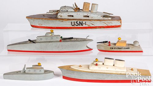 Five wooden toy boats