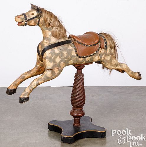 Carved and painted hobby horse on stand, 20th c.