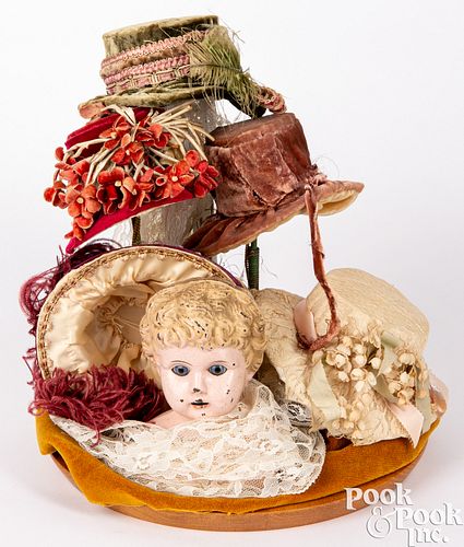 Vintage doll hat display under cloche