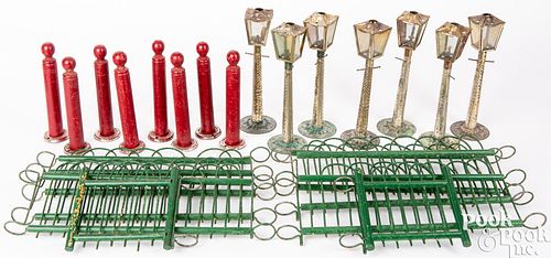 Seven embossed tin toy street lamps
