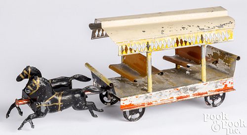Early American tin horse drawn trolley