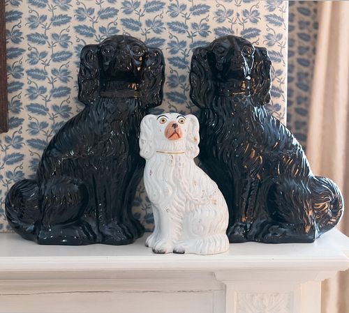 Pair of Staffordshire Black Glazed Spaniels and a White Spaniel