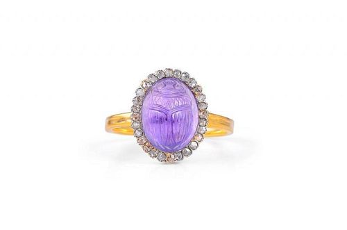 A Gold and Carved Amethyst Ring