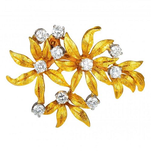 A Gold and Diamond Flower Clip