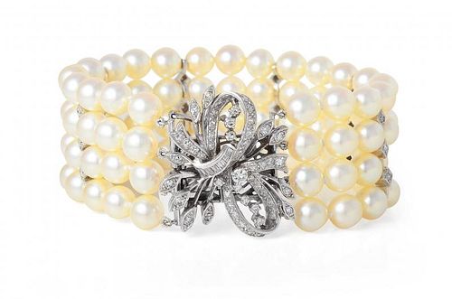 A Four Strand Cultured Pearls and Diamond Bracelet
