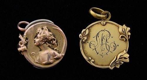 Art Nouveau medallion pendants, one with portrait of a lady and Irises' after Emile Dropsy, 2.8 cm, signed, mark for gold pla