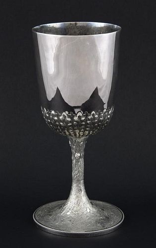A small quantity of silver plate to include two covered entree dishes, a chalice cup with leaf capped lower decoration, and a